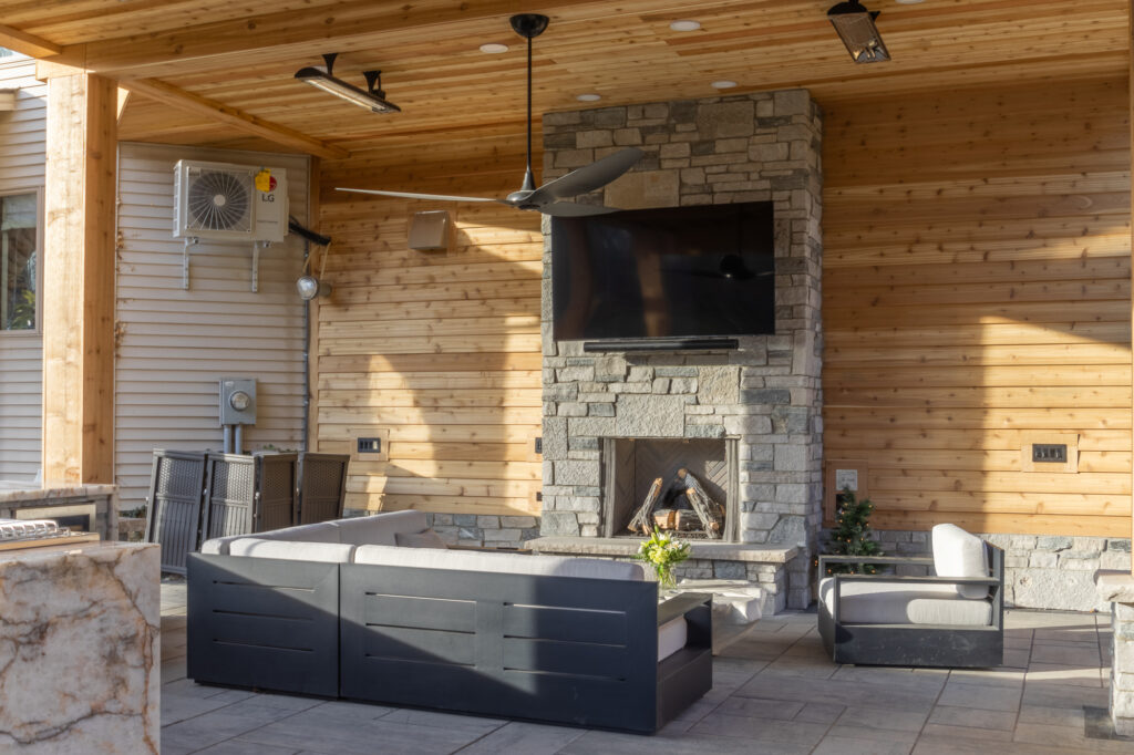 Outdoor Lounge Area with Stone Fireplace