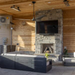 Outdoor Lounge Area with Stone Fireplace