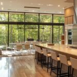 a modern, sleek kitchen in a stylish ohio home features innovative smart appliances seamlessly integrated into the design, showcasing cutting-edge technology that emphasizes efficiency and cost-saving solutions.